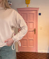 Fluresk - beige sweater met strik