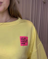 Juliette's yellow sweater