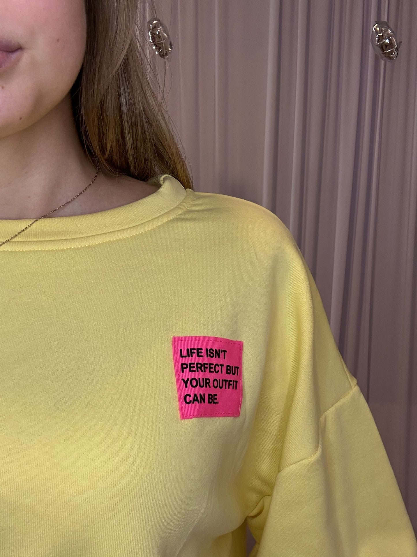Juliette's yellow sweater