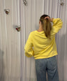 Juliette's yellow sweater