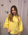 Juliette's yellow sweater