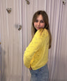 Juliette's yellow knitwear